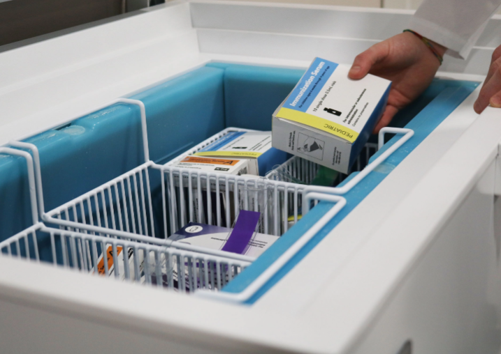 Supplies stored in baskets in a TempArmour vaccine refrigerator