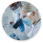 Scientist in mask and googles working in the lab